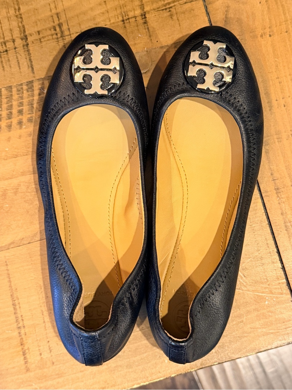 Tory Burch Black Leather Logo Ballet Flats with Silver Emblem